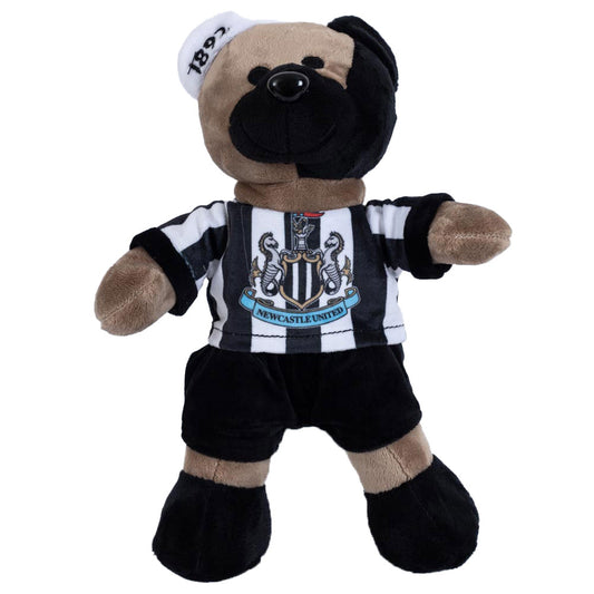 Soft to touch brown and black plush bear, With stitched features plus wearing a classic NUFC home kit