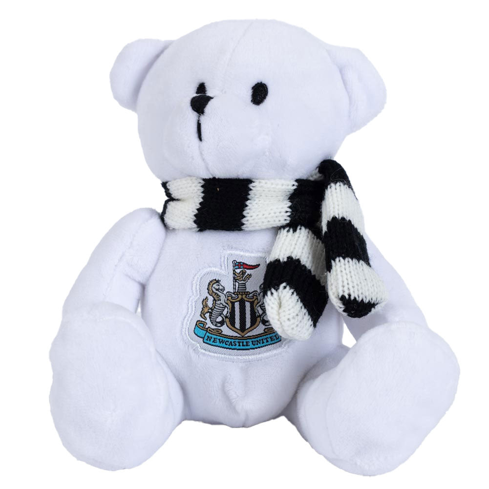 Soft to touch white plush bear, With stitched features and a large woven crest