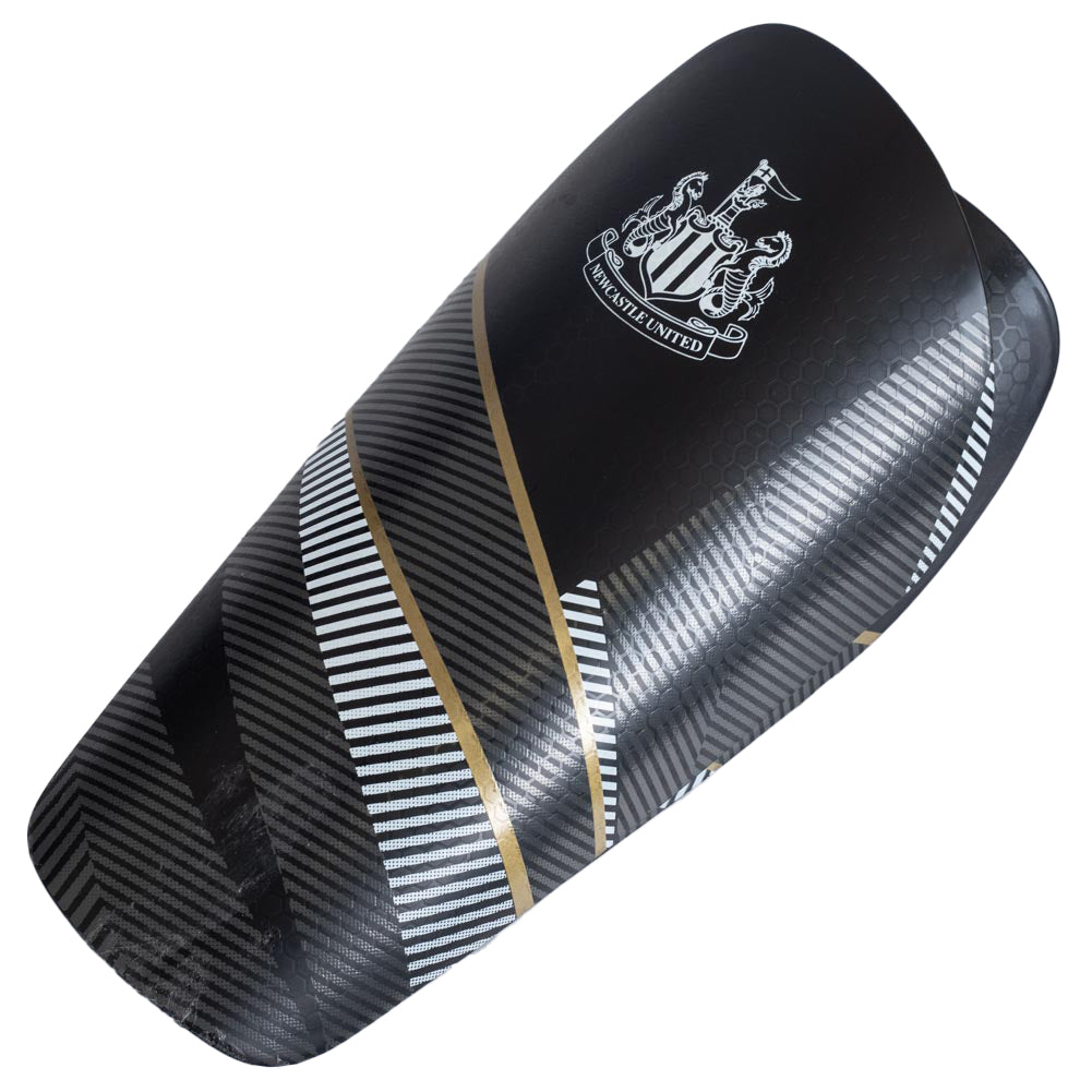 Black fuse design slip in shin guards featuring the Newcastle United crest in white , Thick moulded plastic shell with a comfortable padded interior