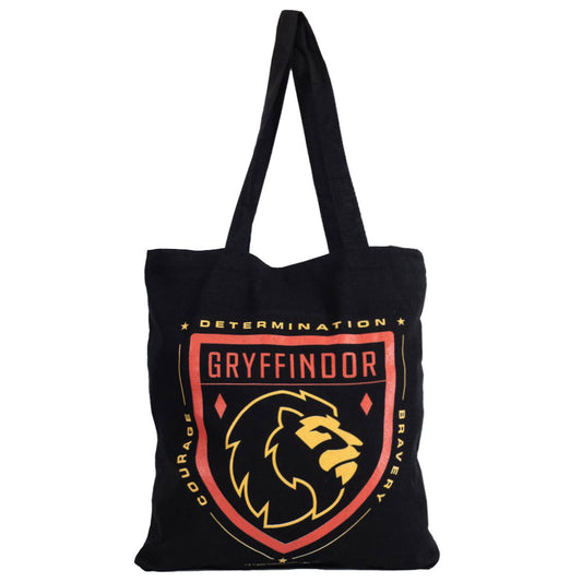Black canvas tote bag featuring a large red and yellow Gryffindor crest to one side 